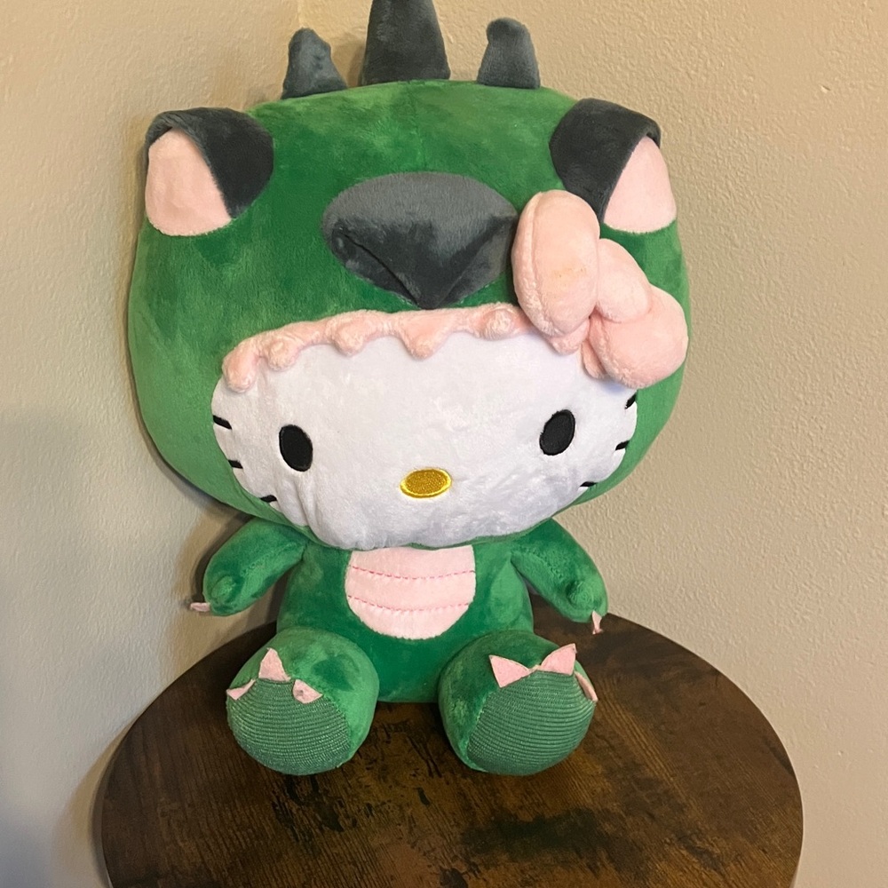 Sanrio Hello Kitty Plush in Green Dinosaur Costume with Pink Accents